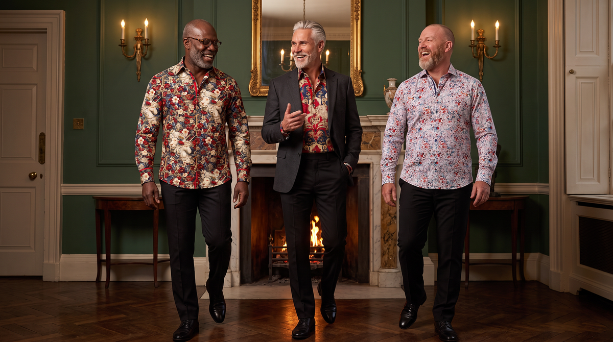 Halloween party outfit for men over 40: three men in a Georgian drawing room - Nigerian-British 52 glasses in Heritage Tapestry, Greek-Cypriot 58 silver hair in Royal Guardian, Scottish 47 shaved head in Wild Bloom