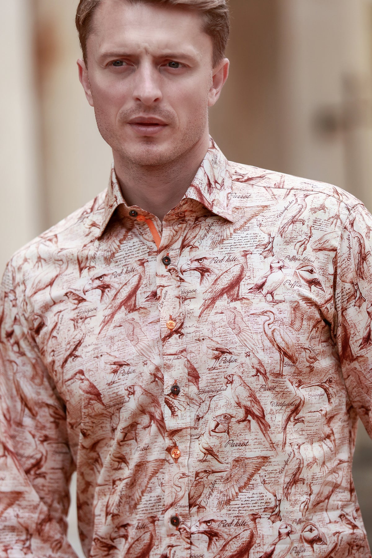Claudio Lugli men's bird sketch print shirt on a model, hand-drawn birds on a white long-sleeve shirt