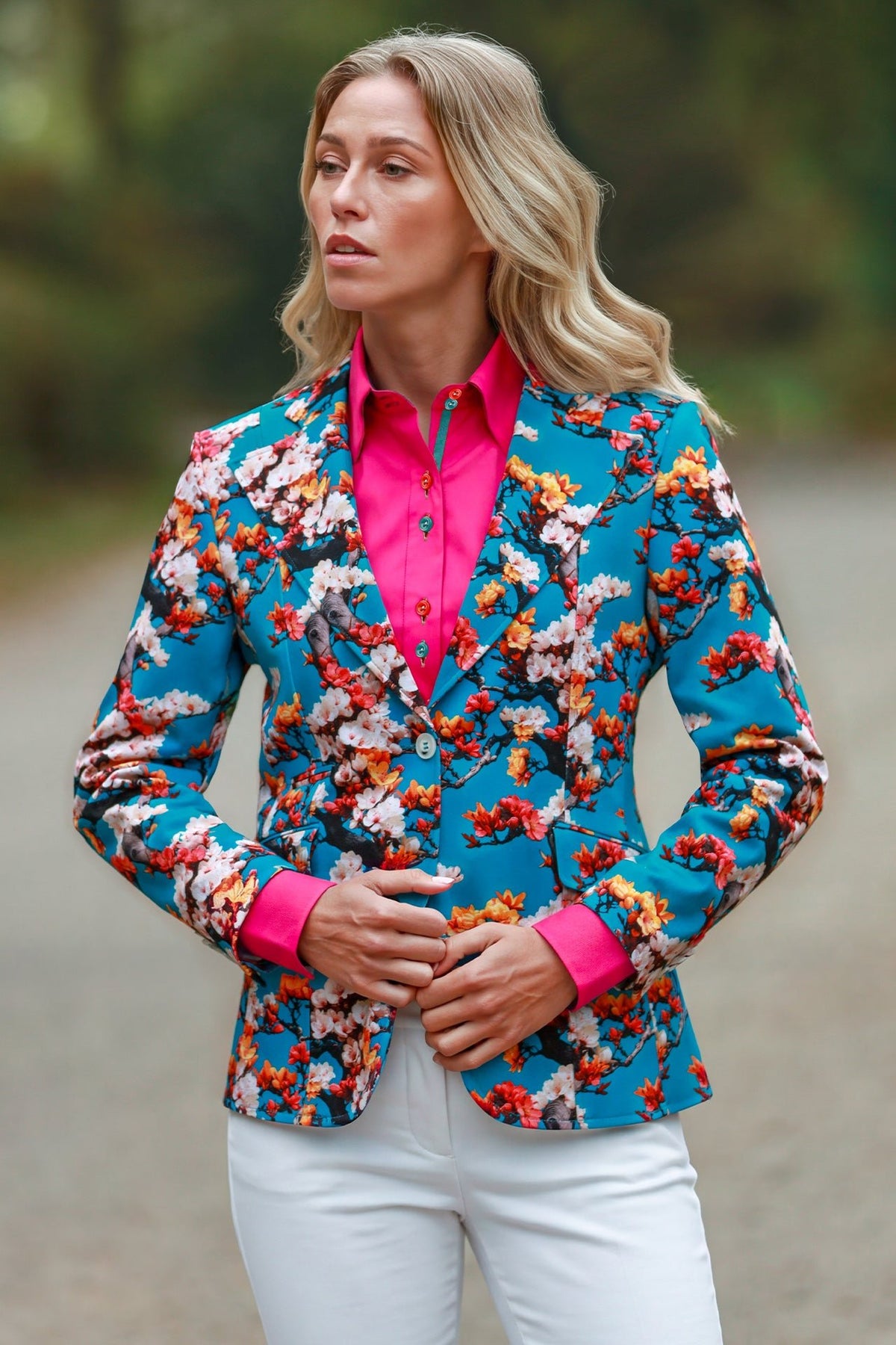 Claudio Lugli Enchanted Garden Print Blazer, aqua floral blazer with coral and ivory blossom worn over a pink shirt, front view