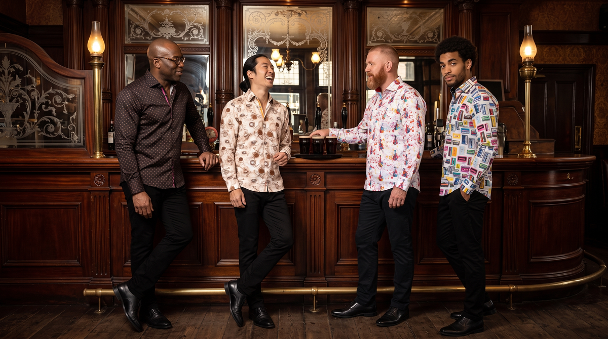 Halloween pub outfit men: four mates at a Victorian pub bar - Ghanaian-British 50 glasses (Cross Beam), Korean-British 33 ponytail (Pocket Watch), Welsh 44 ginger beard (Splash Guitar), Peruvian-Italian 28 curls (Cassette)