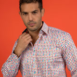 Man wearing a Claudio Lugli Houndstooth Multicolour Printed Shirt against an orange background