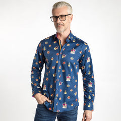 Man wearing "THE CROWN" Regal Print Shirt by Claudio Lugli with colorful crown motifs, bold fuchsia inserts, and vibrant multicolored buttons