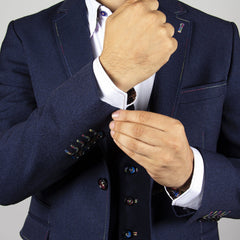 Man wearing black SIGNATURE FITTED JACKET WITH MULTICOLOUR STITCHING adjusting cufflinks