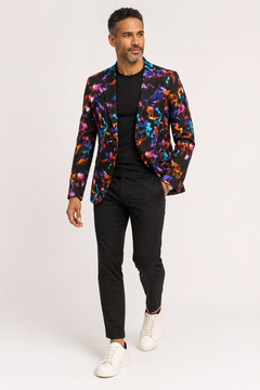 Full-length view of the Neon Smoke print blazer styled with black trousers
