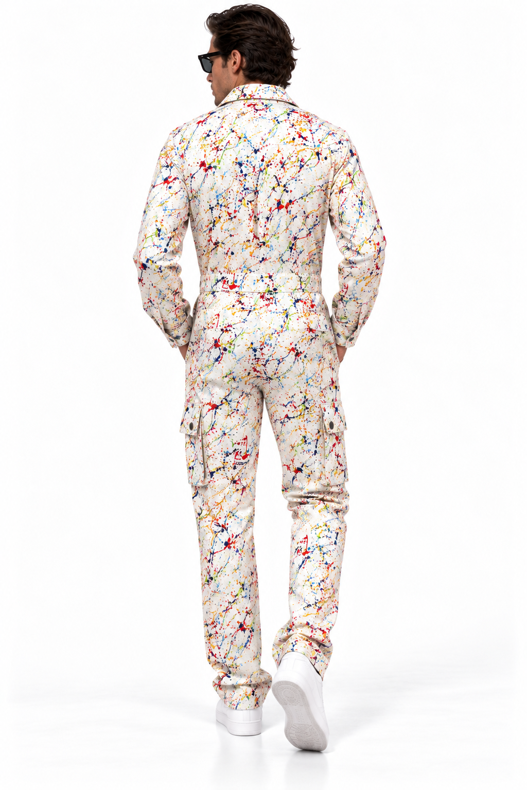 Claudio Lugli Paint Splattered Jumpsuit, rear view on a model showing colourful paint-splash print across the cream back, long sleeves and full-length legs