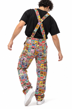 Claudio Lugli Retro Car Service Overalls, rear view on a model showing crossed shoulder straps, back pockets and vintage motoring collage, worn over a black T-shirt