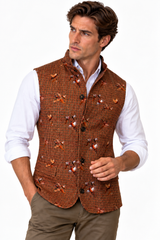 Claudio Lugli men's sleeveless jacket in a rust houndstooth check with pheasants on a model, country shooting gilet