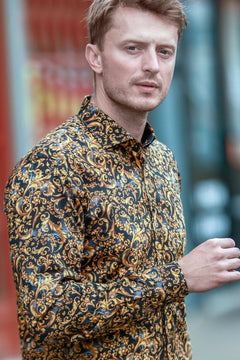 Claudio Lugli Baroque Dynasty Print Shirt, gold and black ornamental print shirt worn outdoors, side view