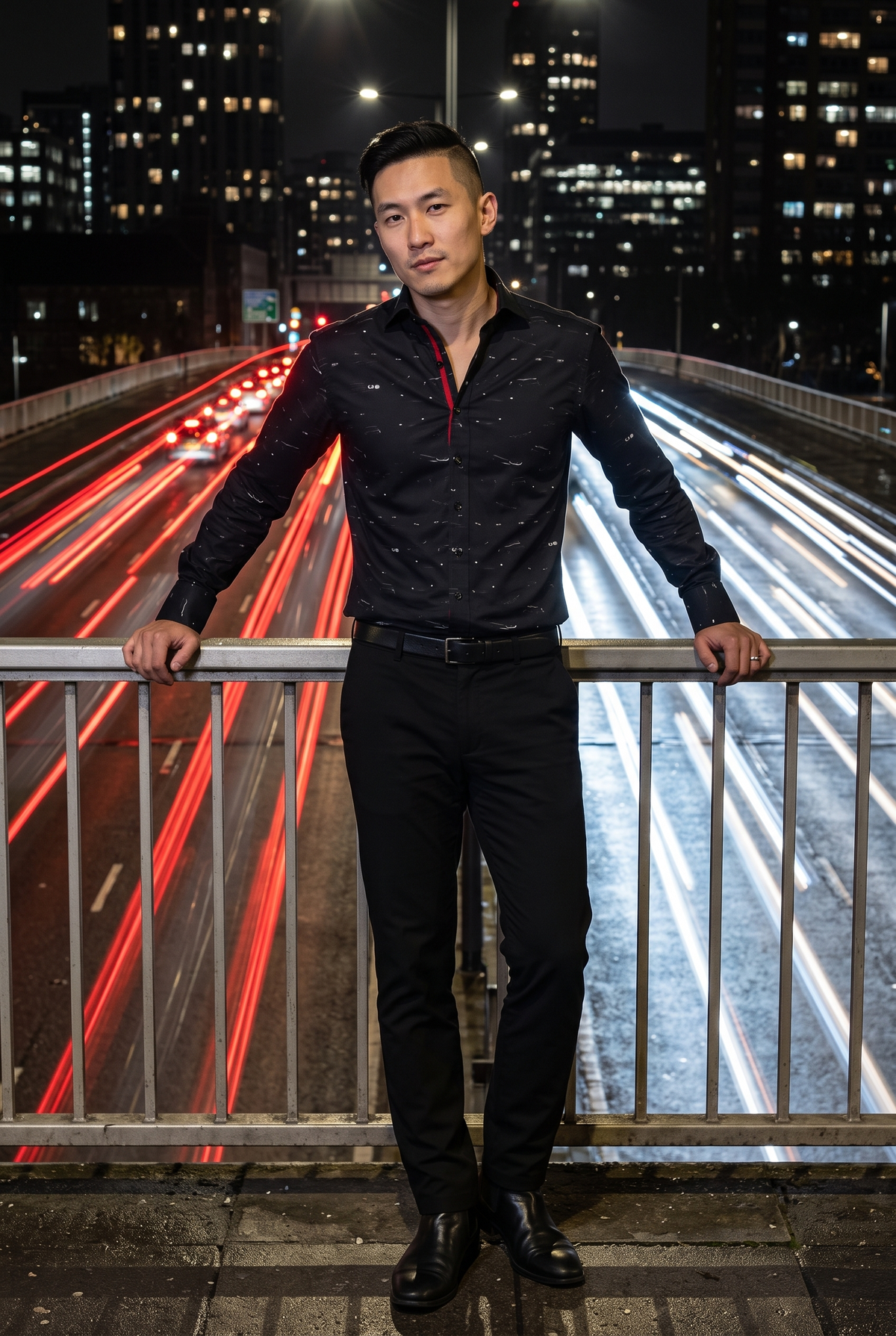 Headlight Print Shirt by Claudio Lugli – night out outfit idea for men. Hands braced on bridge railing, long-exposure headlight trails. Model: Chinese-British, 31, undercut, clean-shaven, lean, silver ring. Designed in London, sizes S to 6XL.